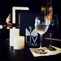 LIV Lounge offers an extensive cocktail menu, diverse wine & beer selections, and small plate appetizers in a warm and inviting environment